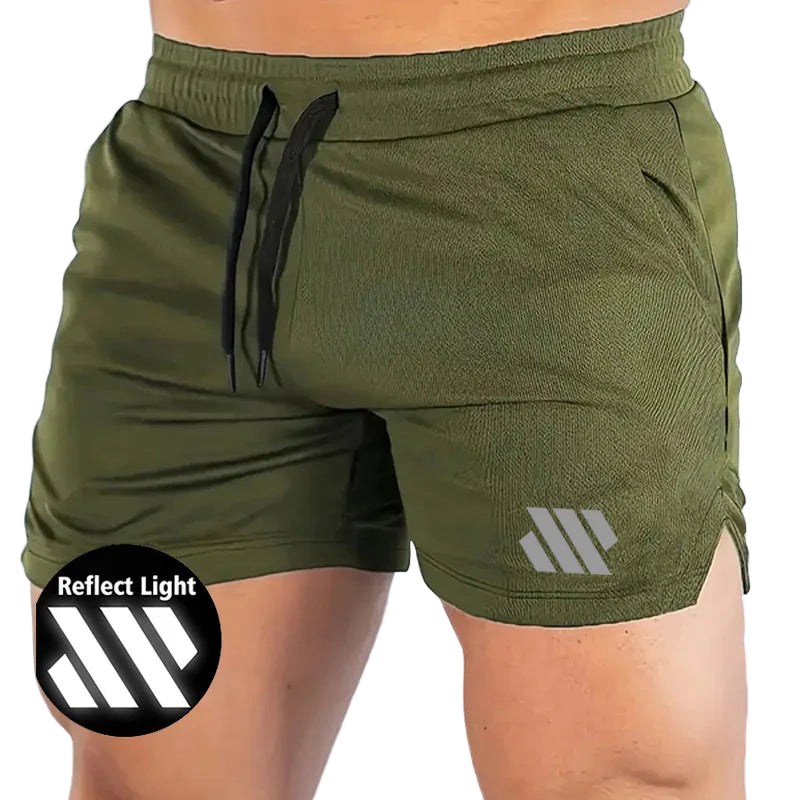 Green athletic shorts with a reflective logo on a light blue background