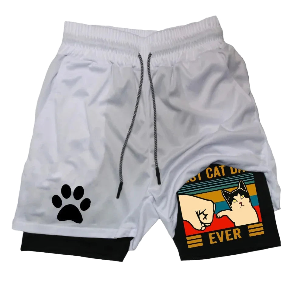 White shorts with a paw print and a small pouch with a cat design on a gray background