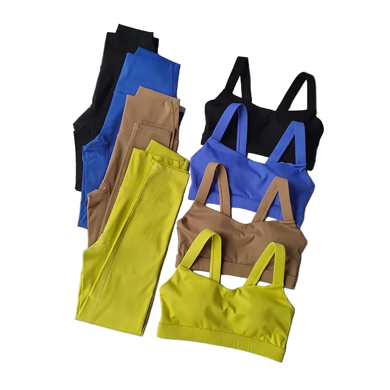 Colorful sports bras and leggings on a gray background